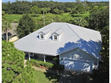 Aerial View. Situated across a wide canal from the