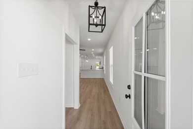 Step into a foyer that showcases the open floor pl