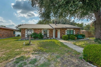 Ranch-style home featuring a front yard