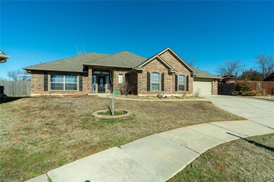 Ranch-style home with front yard and double car ga