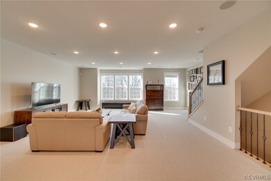 Walk up the stairs to the spacious living room.