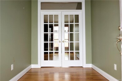 Charming Entryway with French doors into the Great