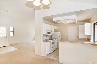 The open floor plan and high ceilings lend a light