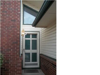 Entry to home has large transom window over doorwa