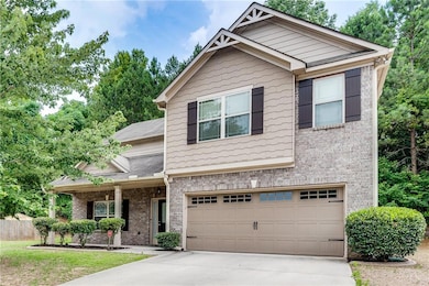 Brick Front House Featuring Front Covered Porch, Garage, Level Drive Way