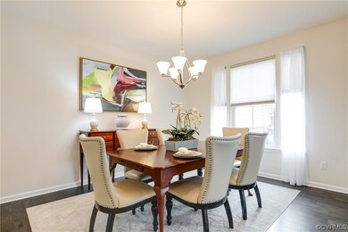 Dining space featuring a notable chandelier and da