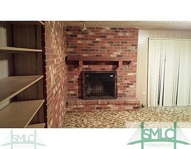 Other. Living Room with Bookshelves and Wood Burni