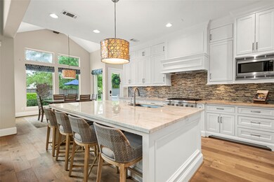 This photo showcases a modern, spacious kitchen wi