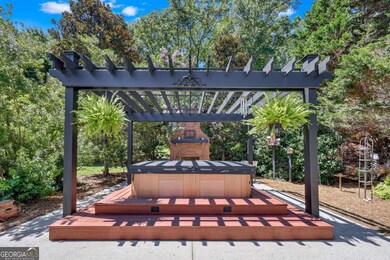 Hot Tub with outdoor fireplace & gardening area