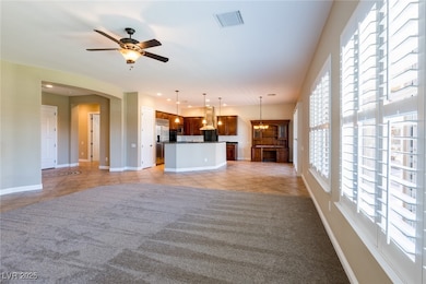 Unfurnished living room featuring light tile patte