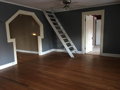 another view of living room and stairs to the loft