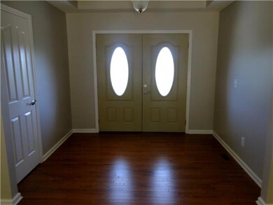 Entry Foyer with hardwood flooring