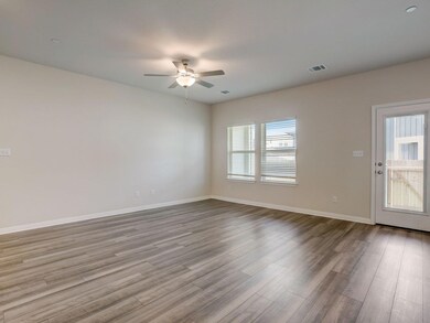 Spare room featuring ceiling fan, wood finished f