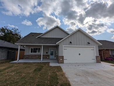 View of front of property with a garage and a fron