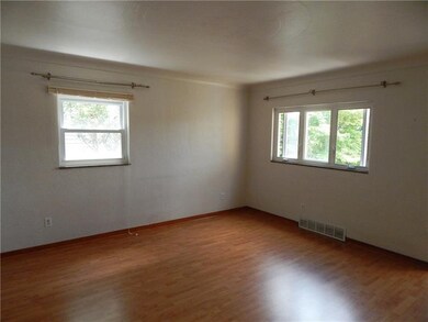 SPACIOUS LIVING ROOM WITH PERGO FLOORING.