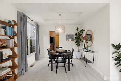 Spacious Living and dining rooms with new carpet and plenty of light