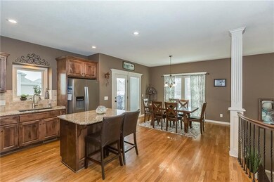 HARDWOOD FLOORS IN THE KITCHEN AND DINING AREA WIT