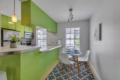 Dining area featuring wood finished floors and ba