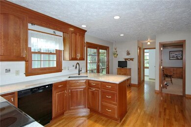 Wood floors flow from the lovely dining room to th