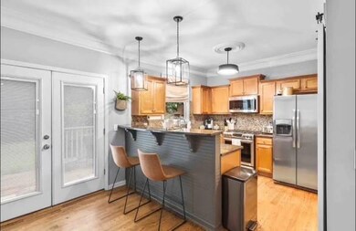 Kitchen featuring french doors, appliances with st