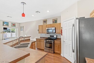 Kitchen with stainless appliances, breakfast bar a