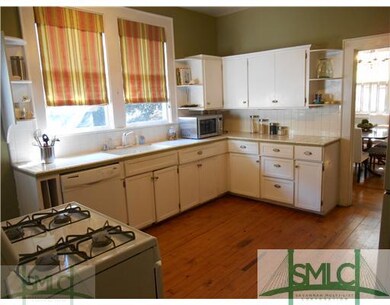 Kitchen. Kitchen has hardwood floors.