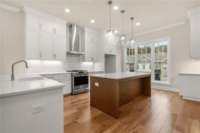GE Profile appliances, quartz countertops and cabinets stacked to the ceiling are just a few of this kitchen's details! *Please note that photos shown are representative of the floorplan but are not photos of the actual home available.