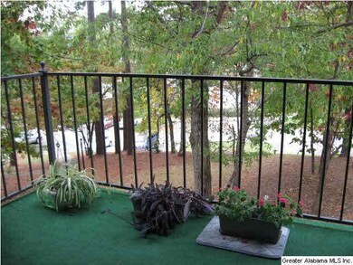 COVERED BALCONY WITH A GREAT VIEW OF MATURE TREES