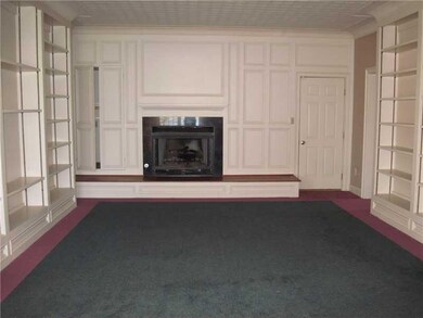 Family Room. Built ins and hidden closet for  stereo systems  large hearth for the gas fireplace  direct access to the garage