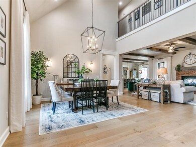 Dining space featuring beamed ceiling, ceiling fan