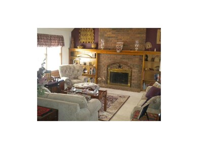 Grand size great room with a wood burning fireplac