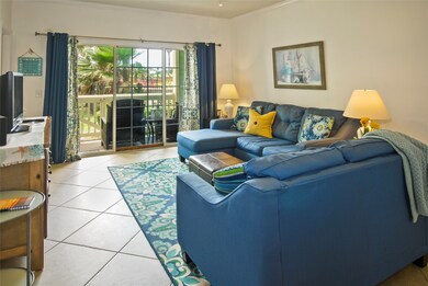 Living room looks out to patio and front green spa