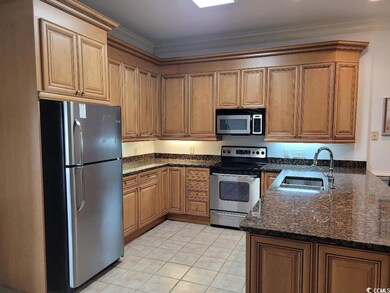Kitchen featuring appliances with stainless steel 