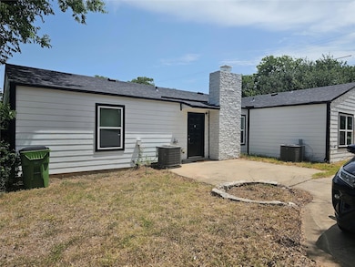 Rear view of property with a patio area, a yard, 