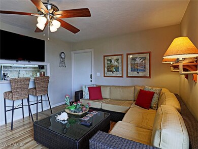 Living room featuring wood finished floors, a ceil