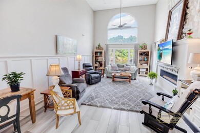 Den area with 18 foot ceilings