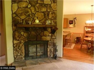 The living room has vaulted ceilings with a floor 