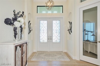 Entrance Foyer featuring Double etched doors, Rece