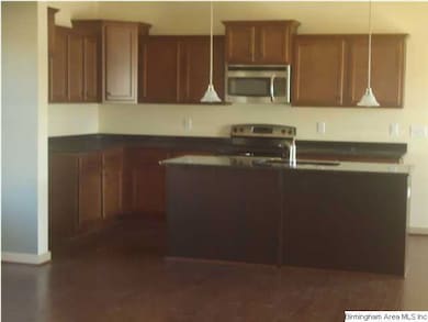 The Kitchen has granite countertops and lots of ca