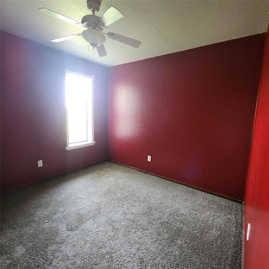 Bedroom featuring carpet flooring and ceiling fan