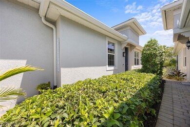 View of side of home featuring stucco siding