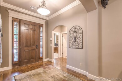 Mahogany front door with sidelights and plantation