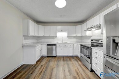Updated Kitchen, New Stainless Appliances, Counter Tops and Tile Back Splash