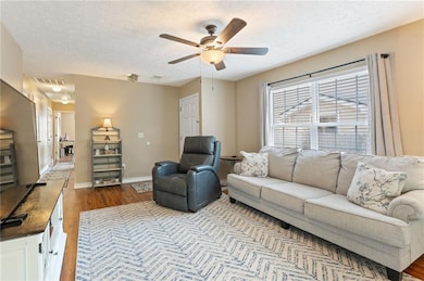 Living room near foyer, with natural light, open t