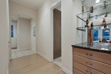 Built-in storage in the front of the formal dining area provides extra space for china or flatware. To the left is the entrance to the 