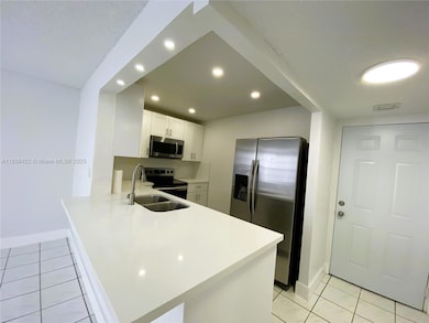 Westland Gardens unit 115, Hialeah, FL 33012 - photo 2
