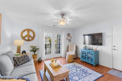 LIVING AND DOORS TO BALCONY