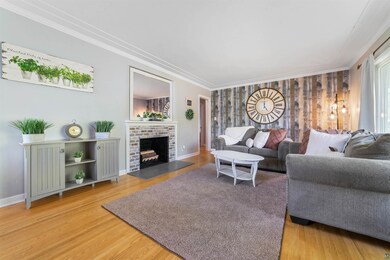 Living room featuring a fireplace, hardwood floors