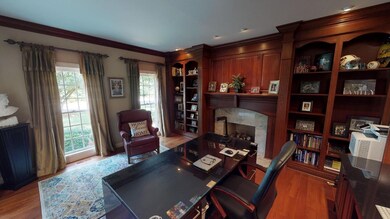 Features a gas log fireplace and many built-ins.