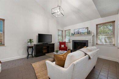 Living area featuring dark tile patterned floorin
